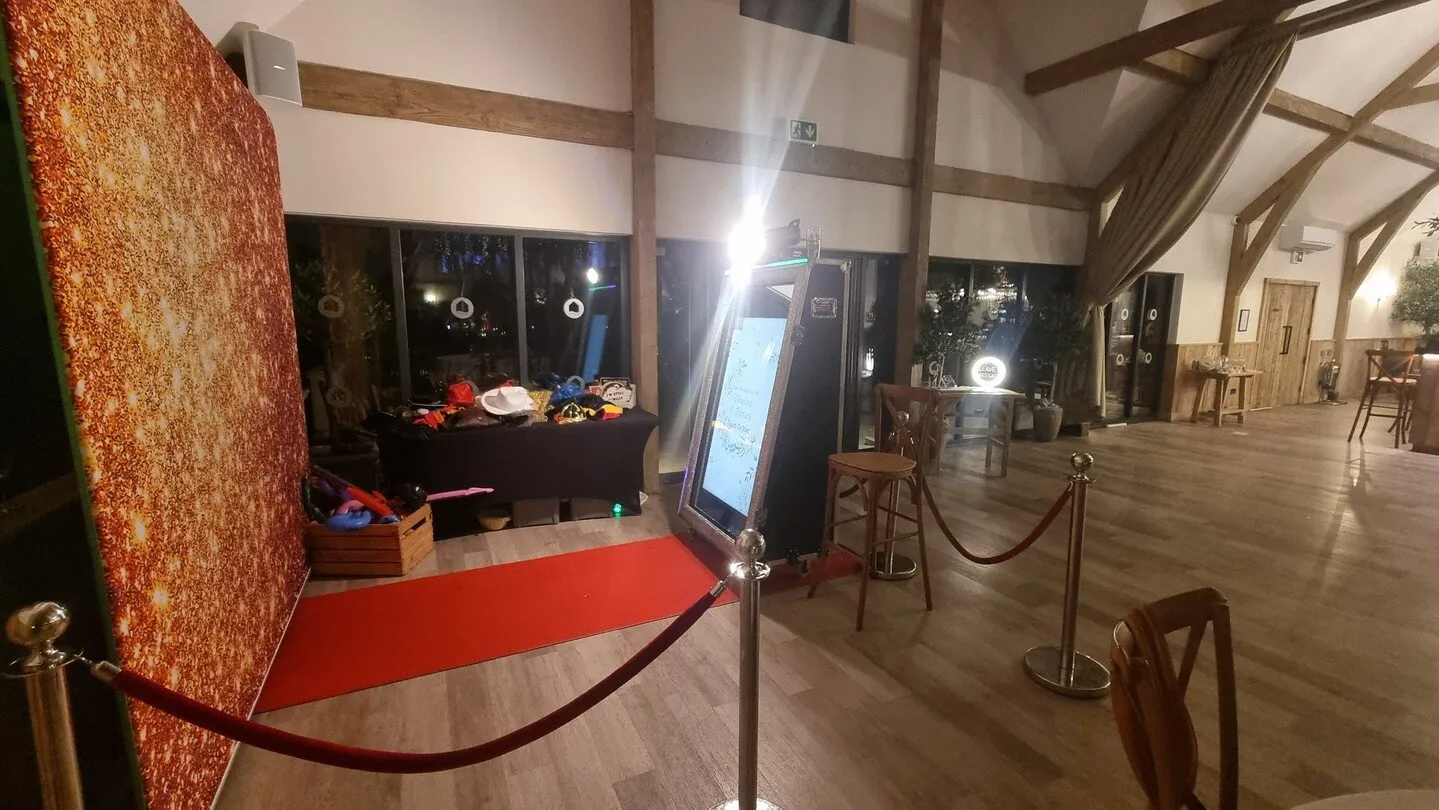 Complete photo booth setup at barn wedding venue